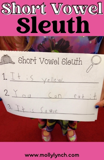 Child holding a worksheet titled "Short Vowel Sleuth" with handwritten answers describing something yellow, edible, and sour.