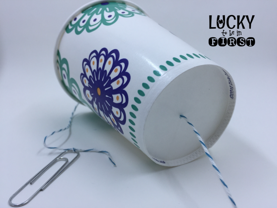 paper cup with a string through it for a science experiment about sound | Lucky Learning with Molly Lynch 