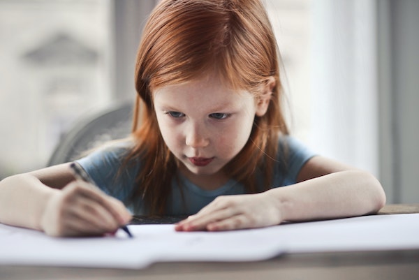 young female student learning to write with less boring words | Lucky Learning with Molly Lynch 