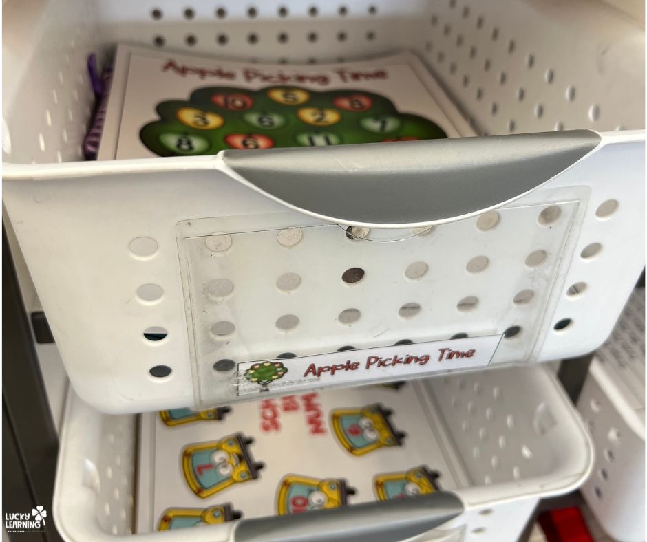 an organizing basket for an apple picking time math game | Lucky Learning with Molly Lynch